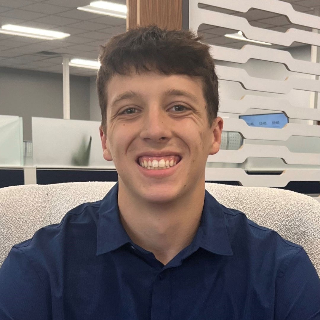 A person sitting in a chairDescription automatically generated
