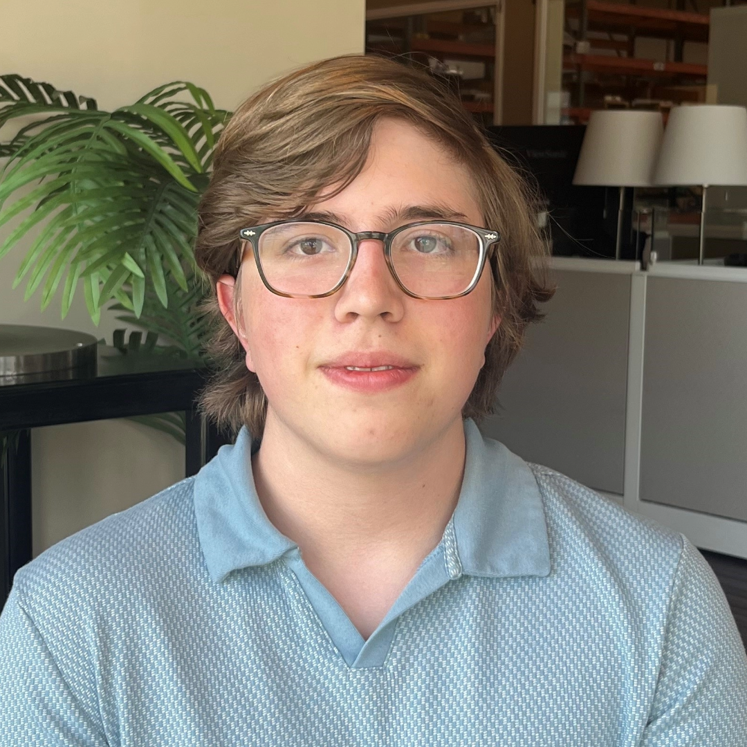 A person sitting in a chairDescription automatically generated