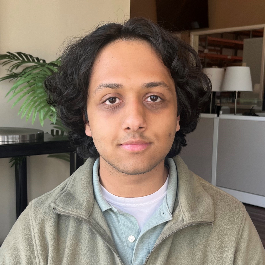 A person sitting in a chairDescription automatically generated