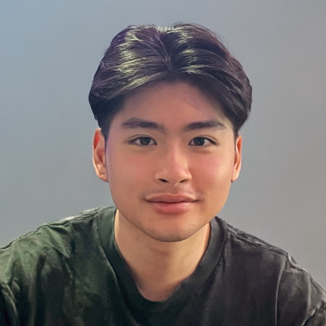 A person sitting in a chairDescription automatically generated
