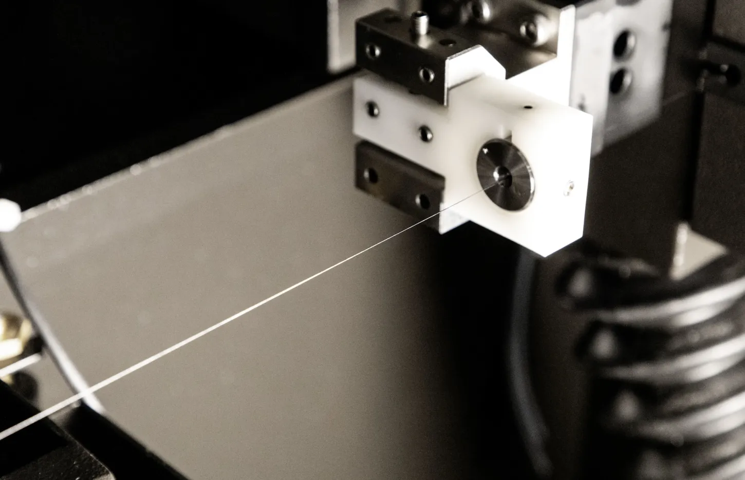 Wire EDM machine cutting off a part
